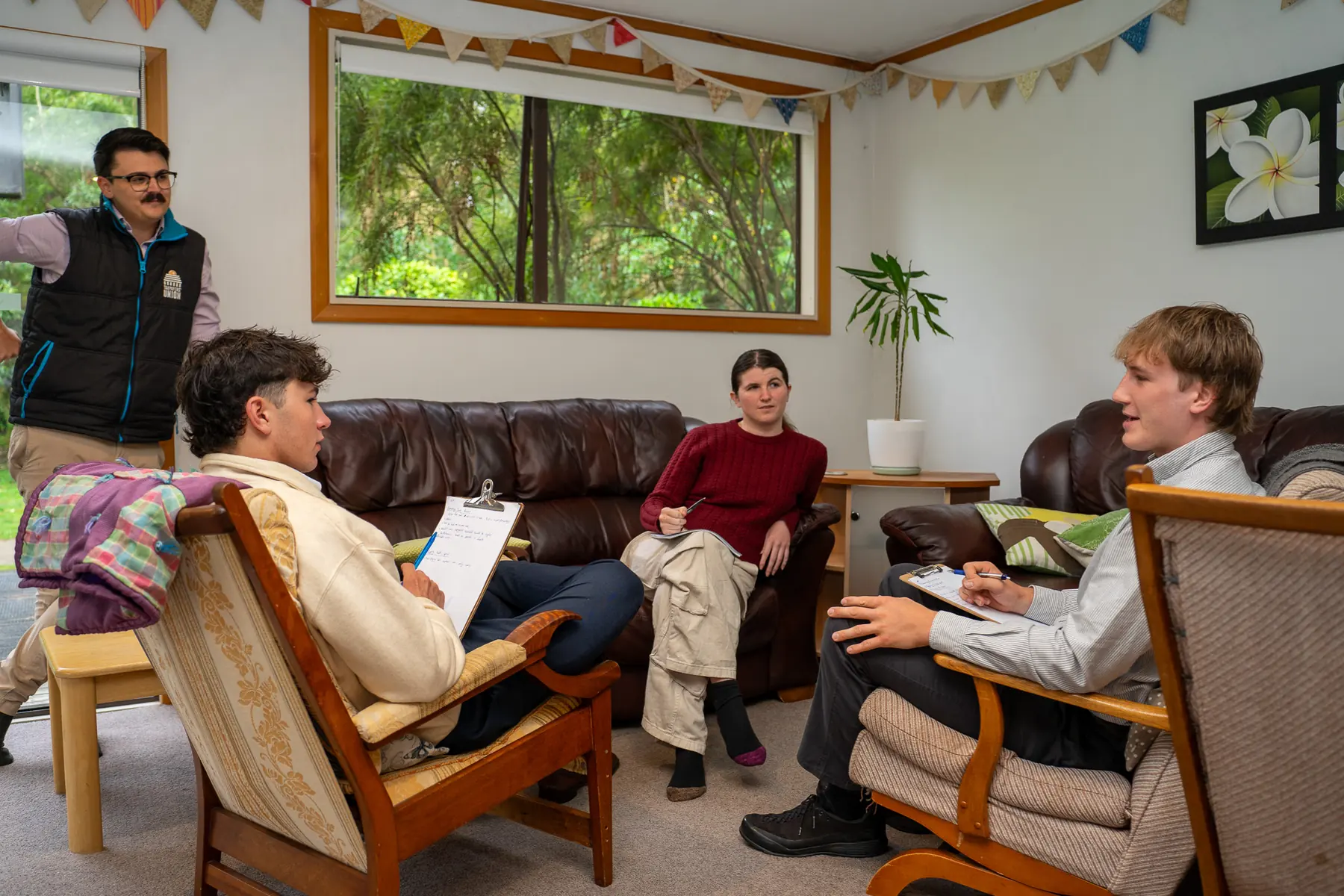 Person leading a discussion in a group setting